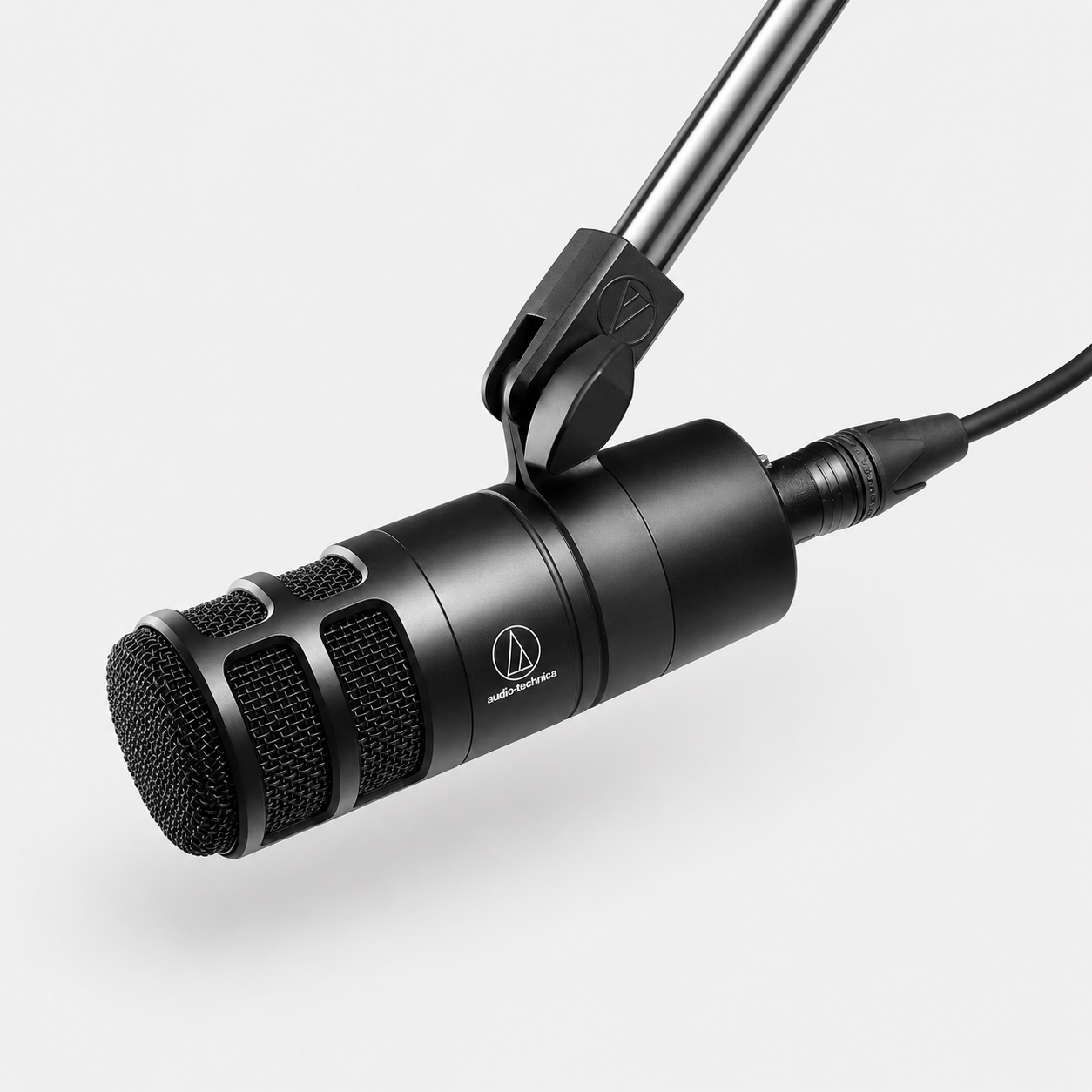 Audio-Technica AT2040 podcast microphone attached to arm and cable