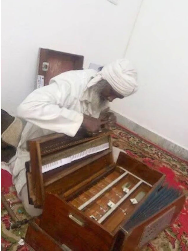 The harmonium technician repairing harmonium
