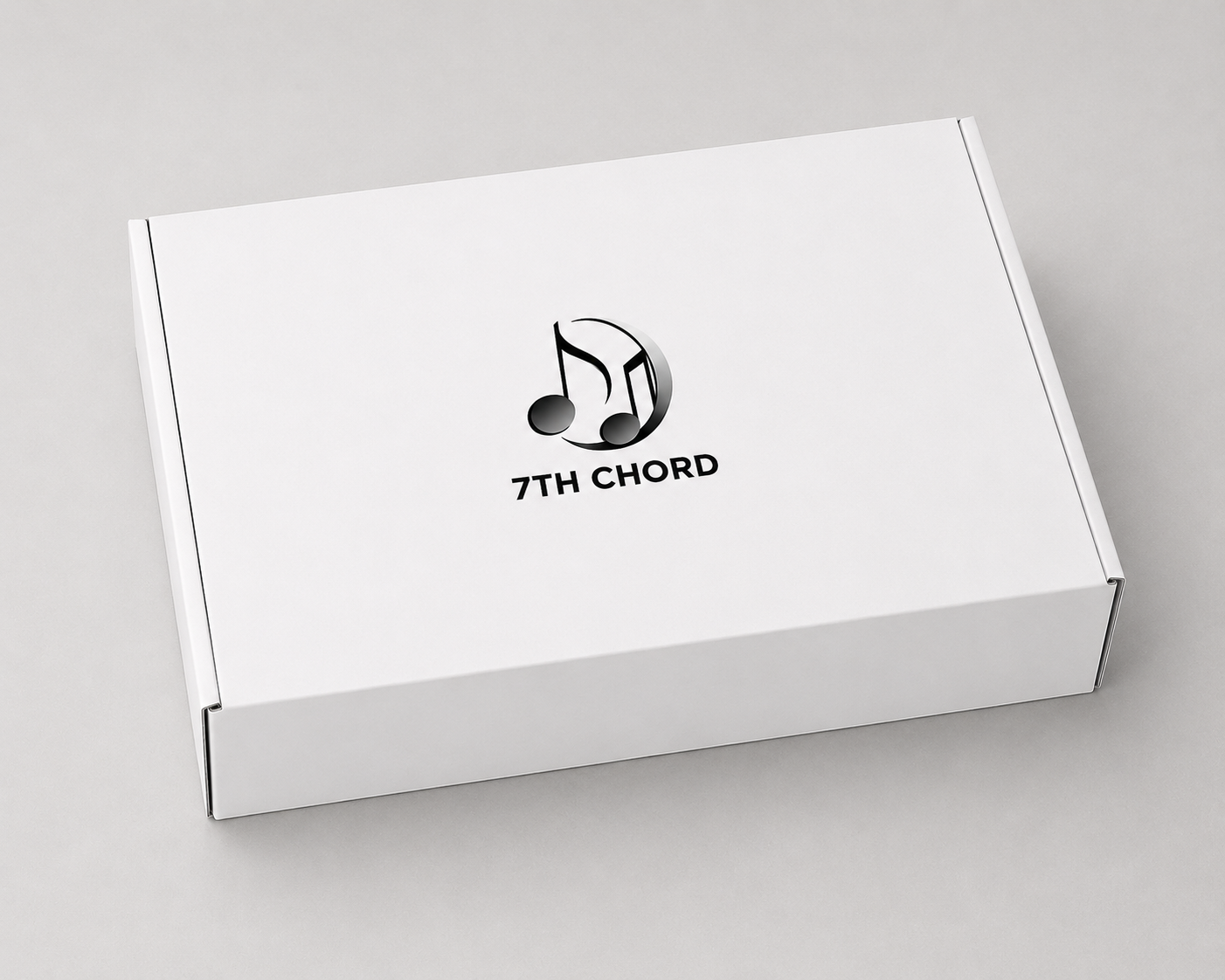 Minimalist white custom packaging featuring the 7th Chord logo, containing the Spark Bundle for Solo Podcasting kit.