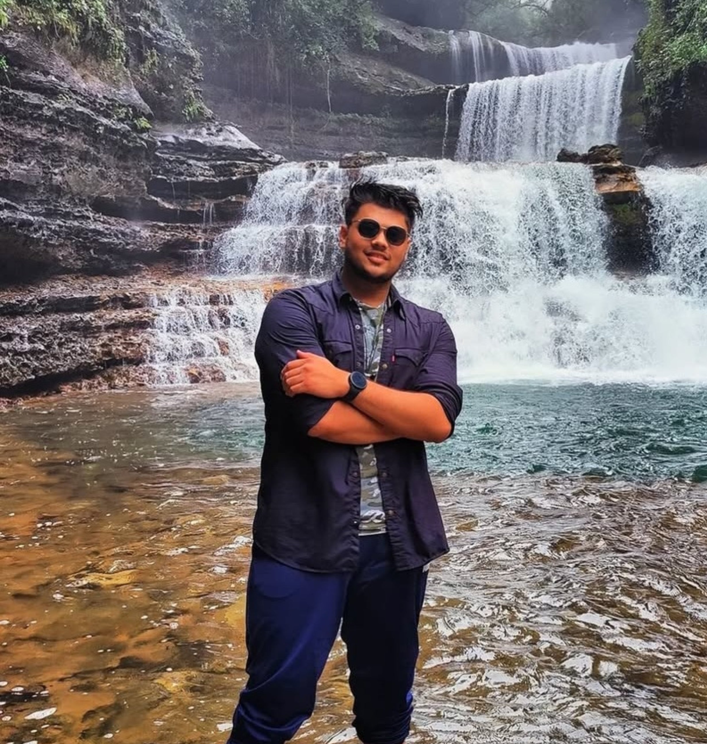 A picture of our customer 'Advit Namdeo' with natural fountains in the background